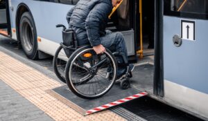 Person with a physical disability enters public transport