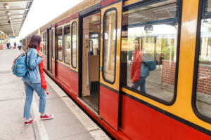 Young woman boarding a train